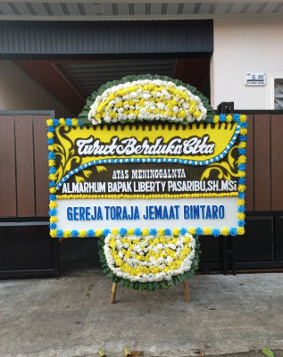 Papan Bunga Duka di Jawa Kiri